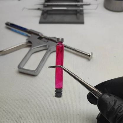 Pistola inyector con dos capsulas intercambiables