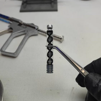 Pistola inyector con dos capsulas intercambiables