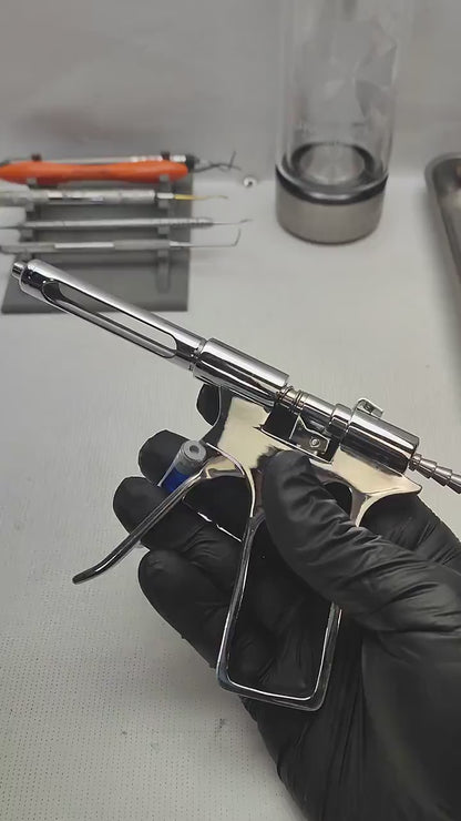 Pistola inyector con dos capsulas intercambiables